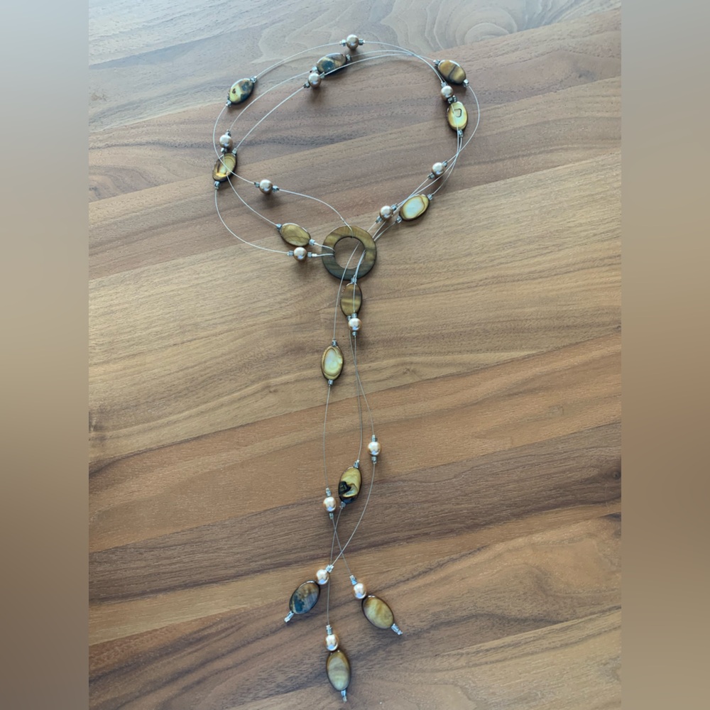 Stunning Lariat Style Neutral-tone Necklace. Polished ovals & beads on SS wire.